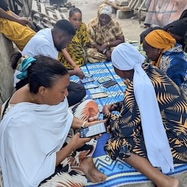 Creating a Local Means of Exchange for African Entrepreneurs: How a Blockchain-Based Community Currency Gained Traction in Tanzania